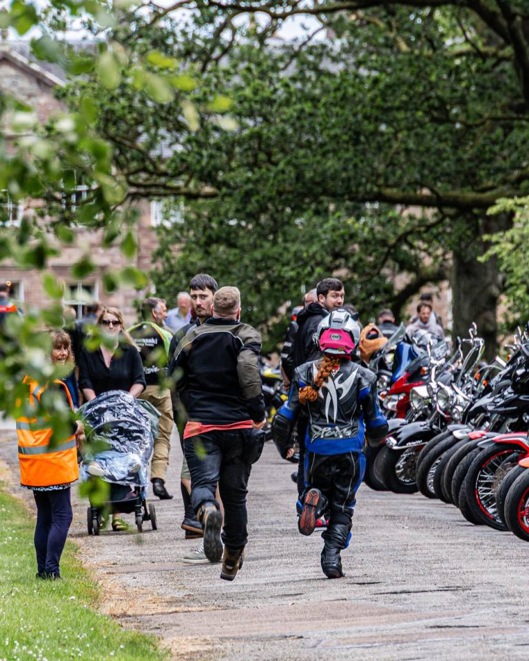 Crowds walking through the bikes