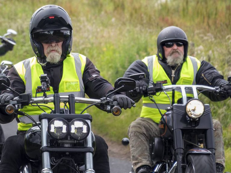 Marshals in hi-vis on their bikes