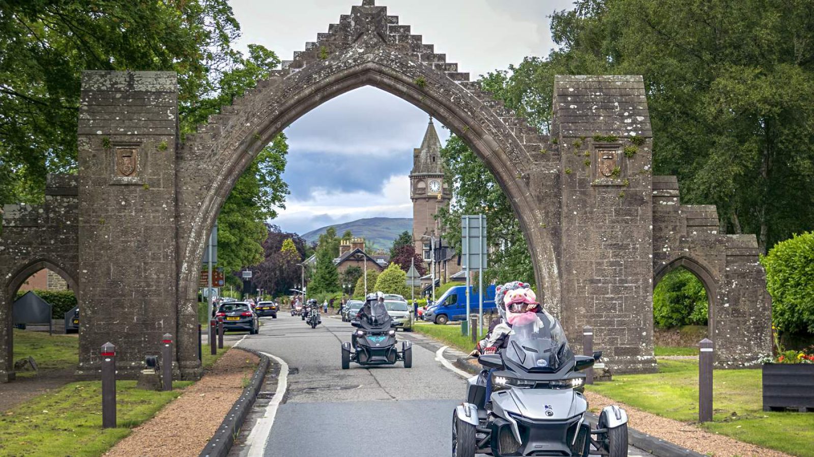 Trikes coming through the castle arch